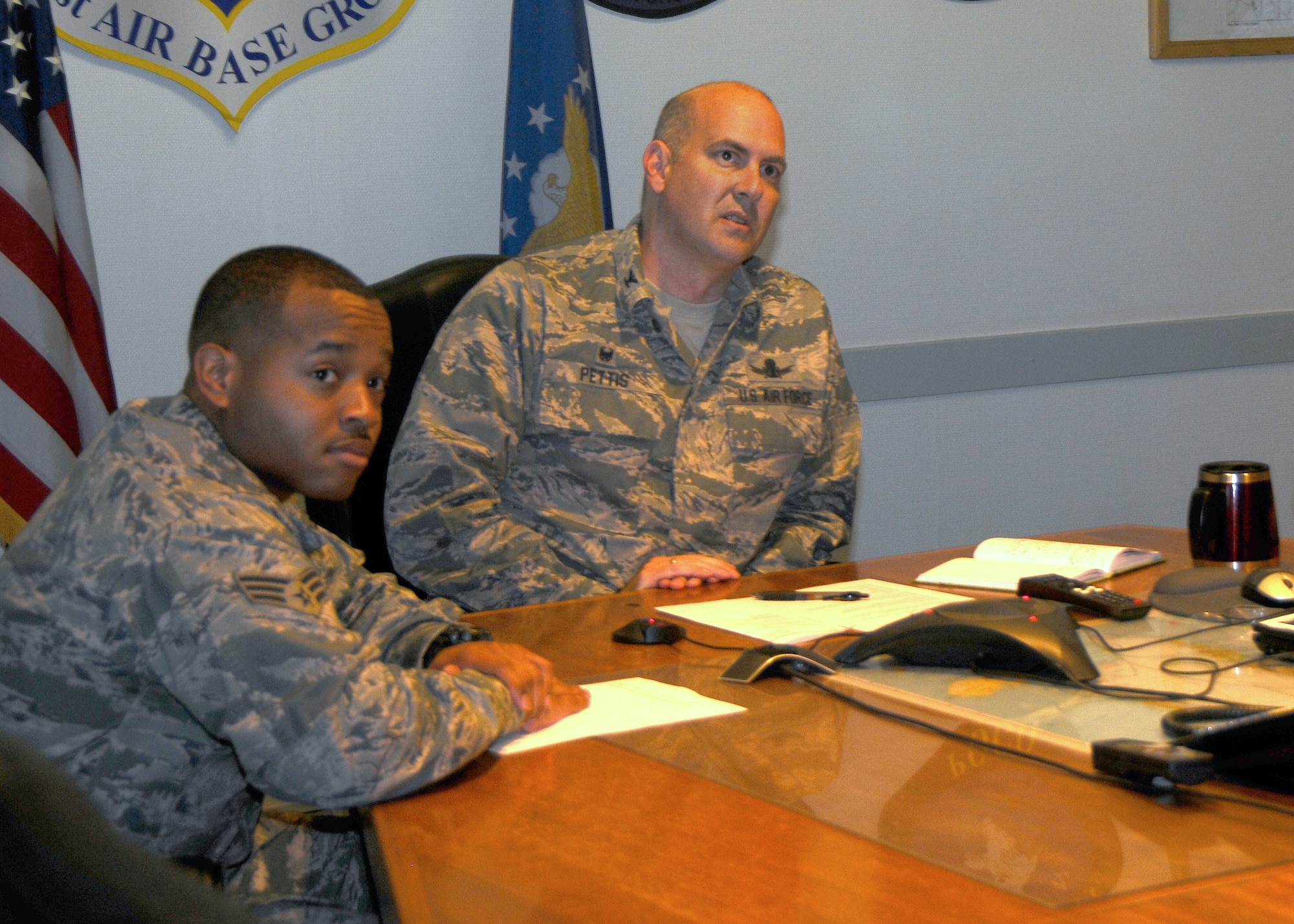 THULE AIR BASE, Greenland -- Col. Stuart Pettis (right), 821st Air Base Group commander, and Senior Airman Taali Ruffin, 821st Security Forces Squadron, prepare for the Worldwide Troop Talk Sept. 1 with Secretary of Defense Ash Carter. Ruffin asked Carter about anticipated enhancements in Thule's strategic mission capabilities. Carter answered by explaining Thule's strategic importance, and stressed the importance of keeping the radar modern and sensitive enough to detect and discriminate threats. The hour-long Troop Talk was the first time the secretary of defense answered Airmen’s questions live during a webcast. (U.S. Air Force photo)