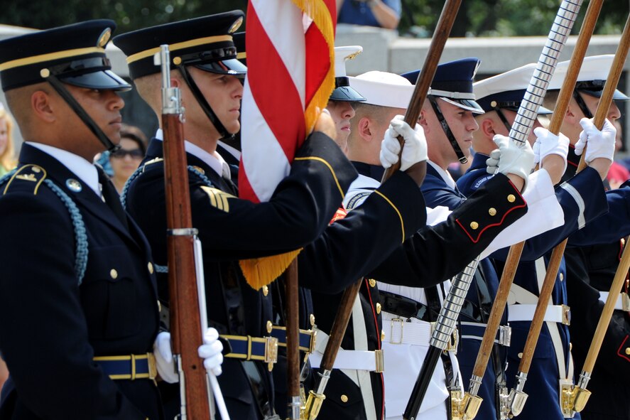 The USAF Honor Guard joins a Joint Service Color Team to pay tribute to
World War II veterans from the Chicago area during a Wreath Ceremony at the
National World War II Memorial on Sep. 2. The event was hosted by Honor
Flight Chicago in honor of World War II veterans from the Chicago area.
Honor Flight Chicago was founded to recognize World War II veterans by
flying them free-of-charge to Washington D.C. for a day of honor,
remembrance and celebration.  (U.S. Air Force photo/Staff Sgt. Matt Davis)

