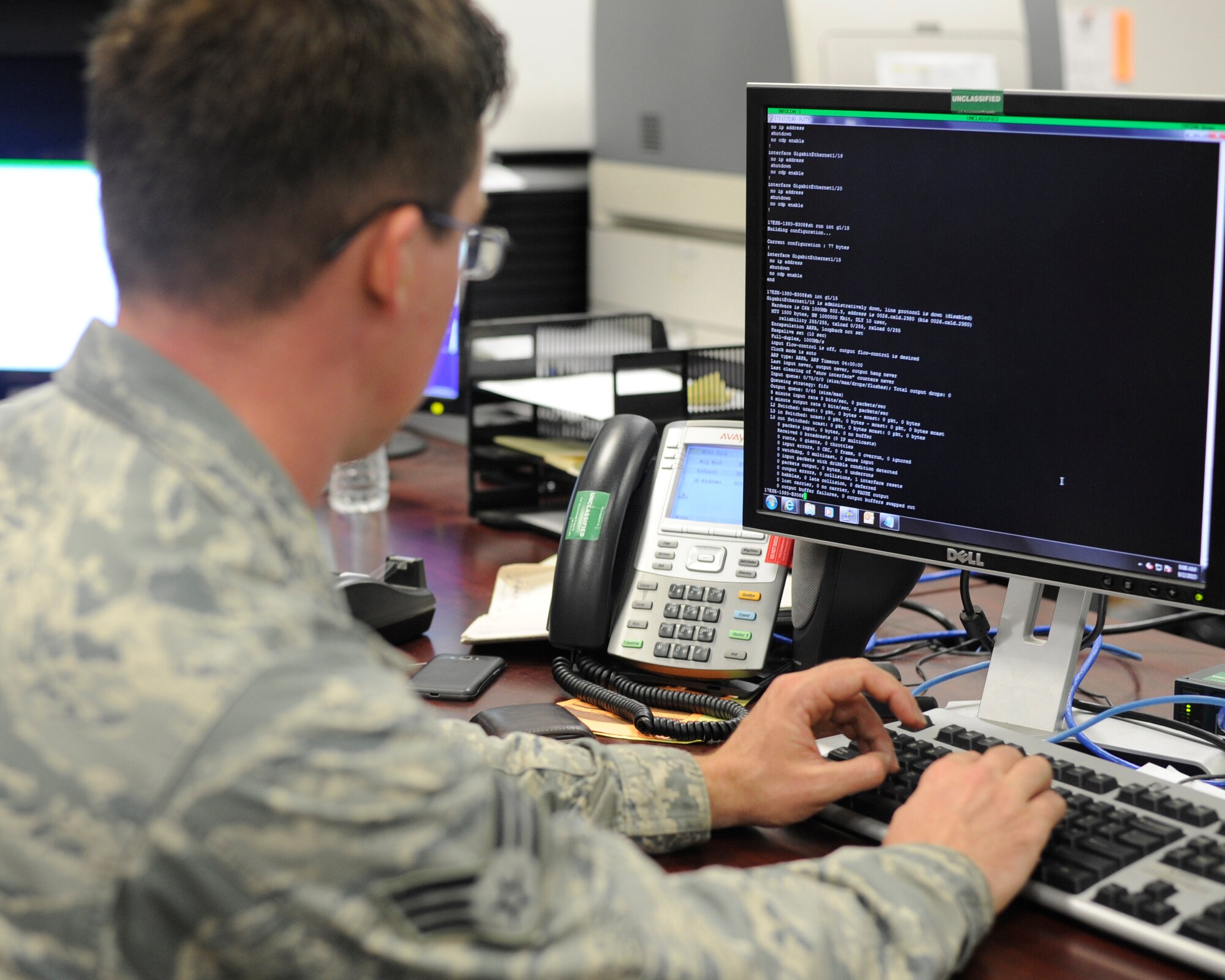 Senior Airman Dylan Connolly, 744th Communication Squadron network management technician, checks the status of network connections Sept. 2, 2015, on Joint Base Andrews. The 14-person shop is responsible for network management of more than 20,000 personnel throughout multiple installations in the National Capitol Region. (U.S. Air Force photo by Senior Airman Preston Webb/Released)