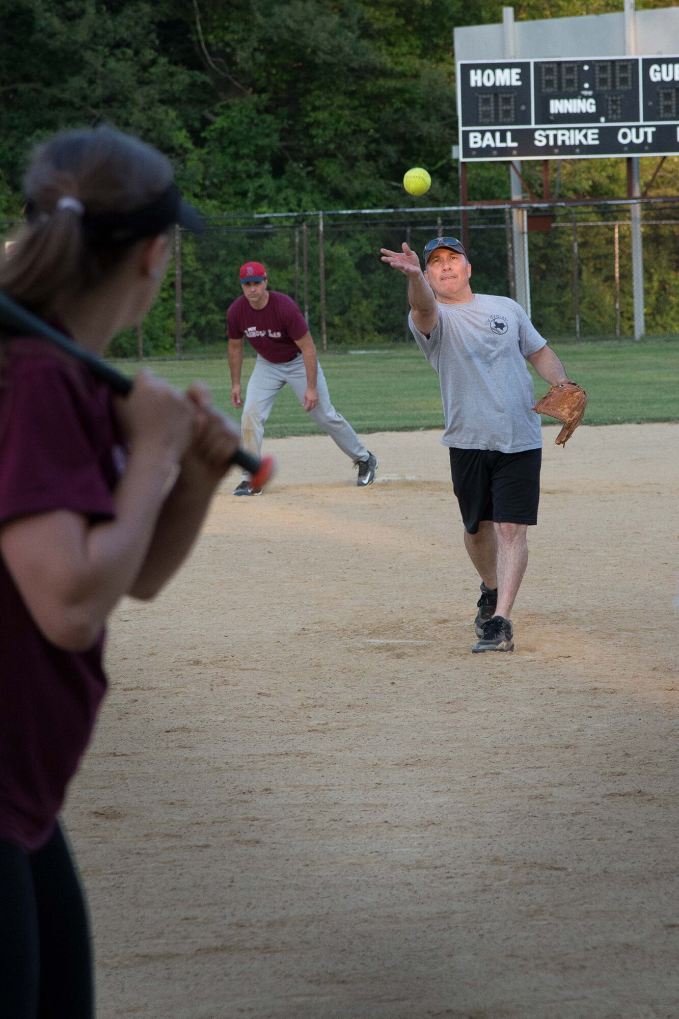 Sgt. 1st Class Gene Garcia, a member of the 66th Air Base Group intramural softball team, throws a pitch to a member of the MIT-Lincoln Lab team during the intramural championship game on base Sept. 1. The 66 ABG team went on to win the championship game by a score of 16 to 5. (U.S. Air Force photo by Mark Herlihy)