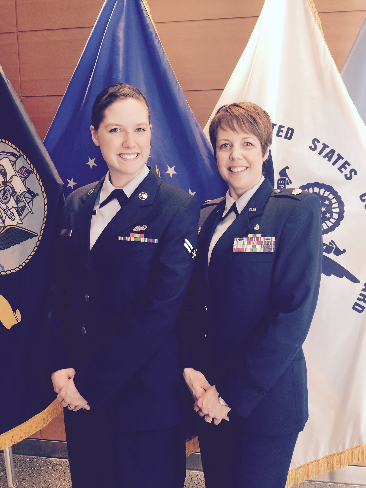 Then Airman 1st Class Kara Watts and her mother, Maj. Tobie Wethington, pose for a photo at the Air Force surgeon general promotion at the Defense Health Headquarters in Falls Church, Va., earlier this year. Watts, now a senior airman and a 66th Comptroller Squadron administration specialist, as well as her mother, who is an Information Management Information Technology fellow at the Defense Information Systems Agency, are both currently serving on active duty. (Courtesy photo)