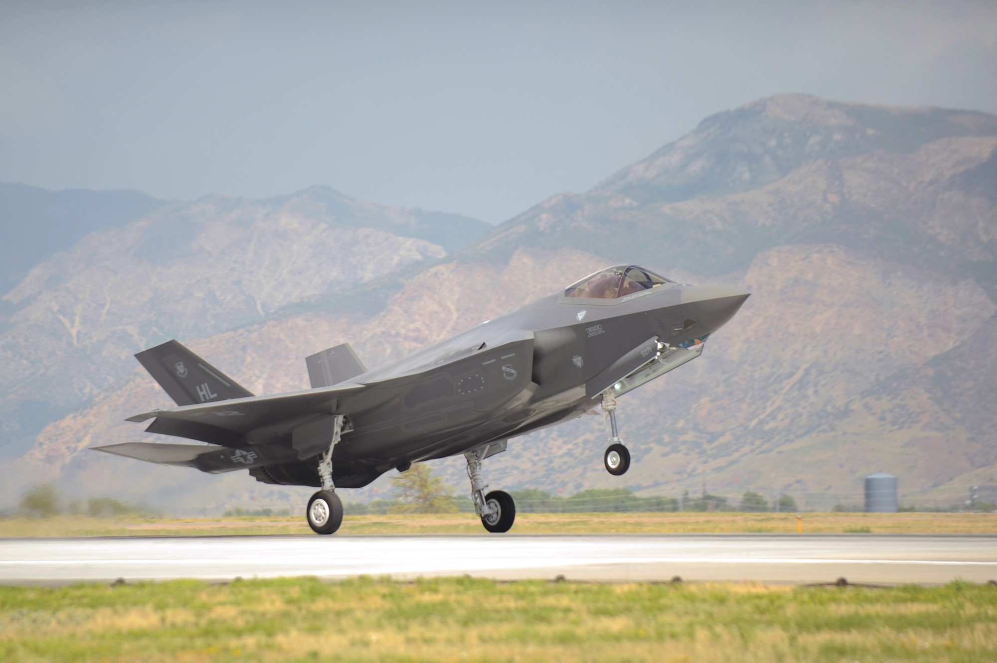 An F-35A Lightning II aircraft piloted by Col. David Lyons, 388th Fighter Wing commander, touches down at Hill Air Force Base, Utah, Sept. 2, 2015. This and another fighter jet piloted by Lt. Col. Yosef Morris, 34th Fighter Squadron director of operations, were the first two operational F-35s to be received at the base. The rest of the fleet of up to 72 F-35s will be coming in on a staggered basis, spread through 2019. Selecting Hill AFB to host America's newest fifth generation fighter is a tribute to the active-duty 388th and Reserve 419th Fighter Wings' rich heritage. It is fitting the 388th Fighter Wing becomes the first operational F-35 unit, just as it was with the F-16 Fighting Falcon aircraft in January 1979. (U.S. Air Force photo by Todd Cromar/Released)