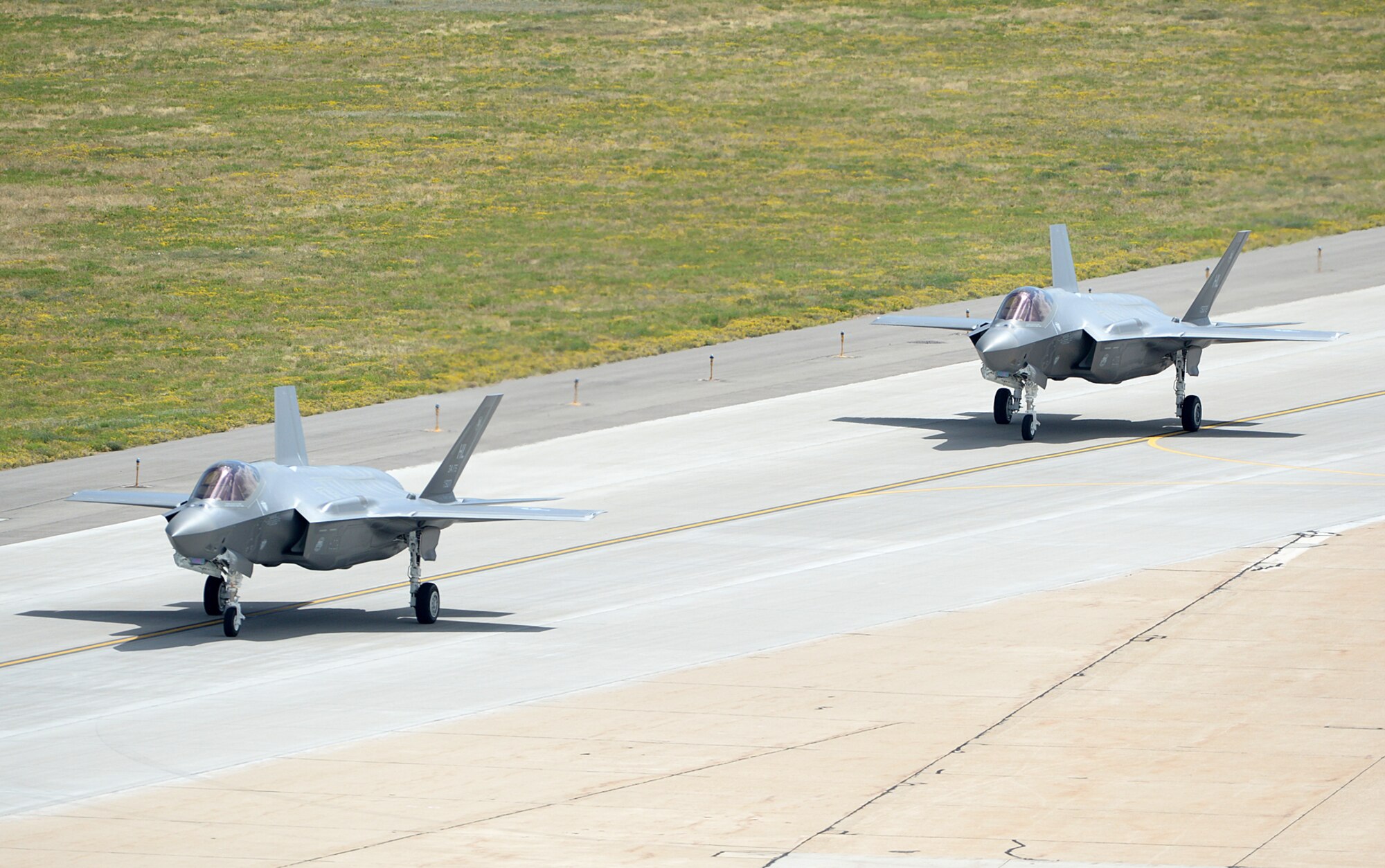 The first two combat-coded F-35A Lightning II aircraft arrive at Hill Air Force Base, Utah, Sept. 2. Hill was selected as the location for the first operational F-35 fleet and will receive up to 70 additional jets on a staggered basis through 2019. Hill Airmen from the active-duty 388th and Reserve 419th Fighter Wings will fly and maintain the fleet. Standing up the first operational F-35 unit at Hill allows for synergy with the co-located F-35 depot maintenance team, and access to the nearby Utah Test and Training Range. (U.S. Air Force photo by Alex R. Lloyd/Released)