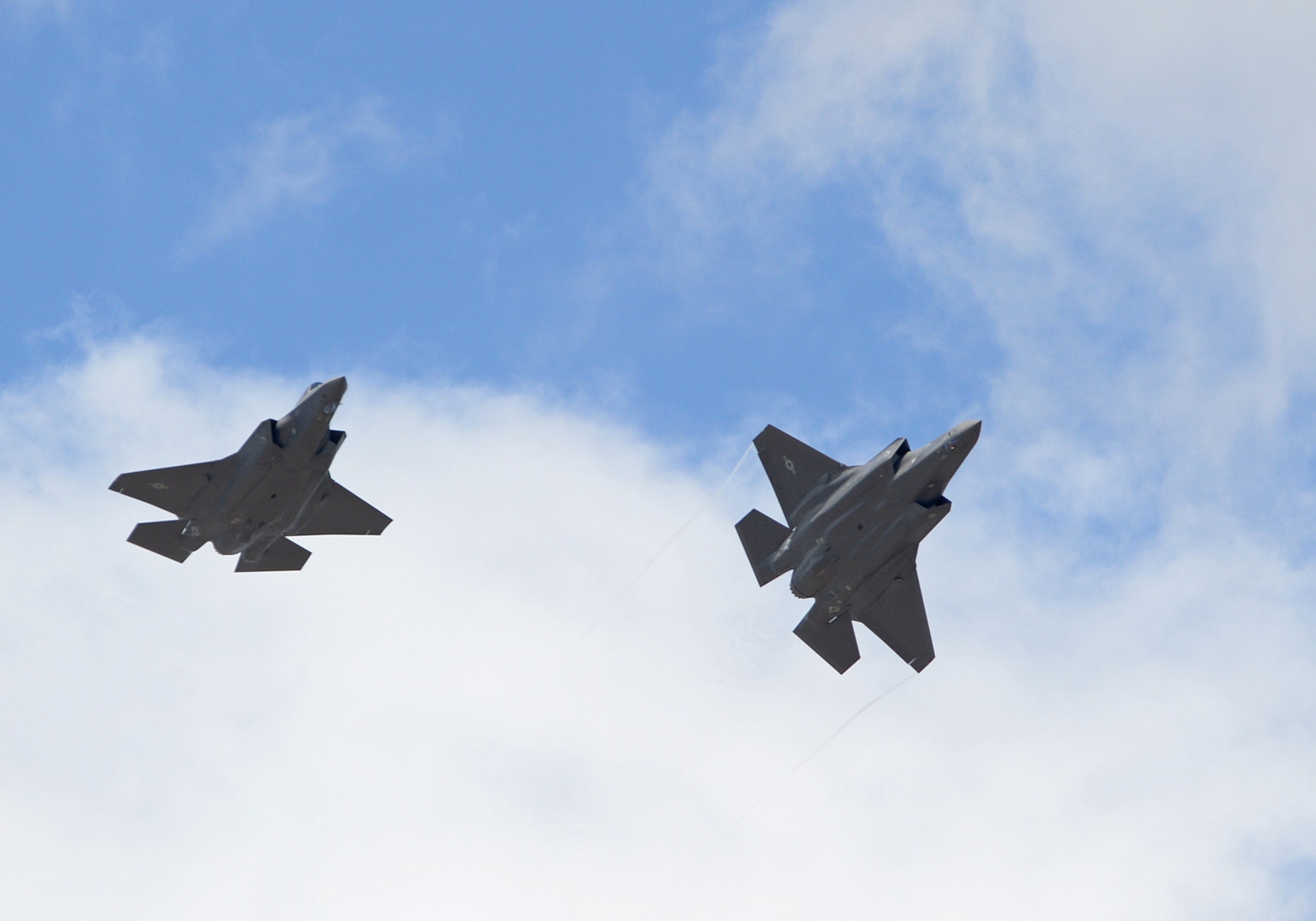 The first two operational F-35A Lightning II aircraft arrive at Hill Air Force Base, Utah, Sept. 2, 2015. The jets were piloted by Col. David Lyons, 388th Fighter Wing commander, and Lt. Col. Yosef Morris, 34th Fighter Squadron director of operations. Hill will receive up to 70 additional combat-coded F-35s on a staggered basis through 2019.  The jets will be flown and maintained by Hill Airmen assigned to the active-duty 388th Fighter Wing and its Reserve component 419th Fighter Wing. (U.S. Air Force photo by Alex R. Lloyd/Released)