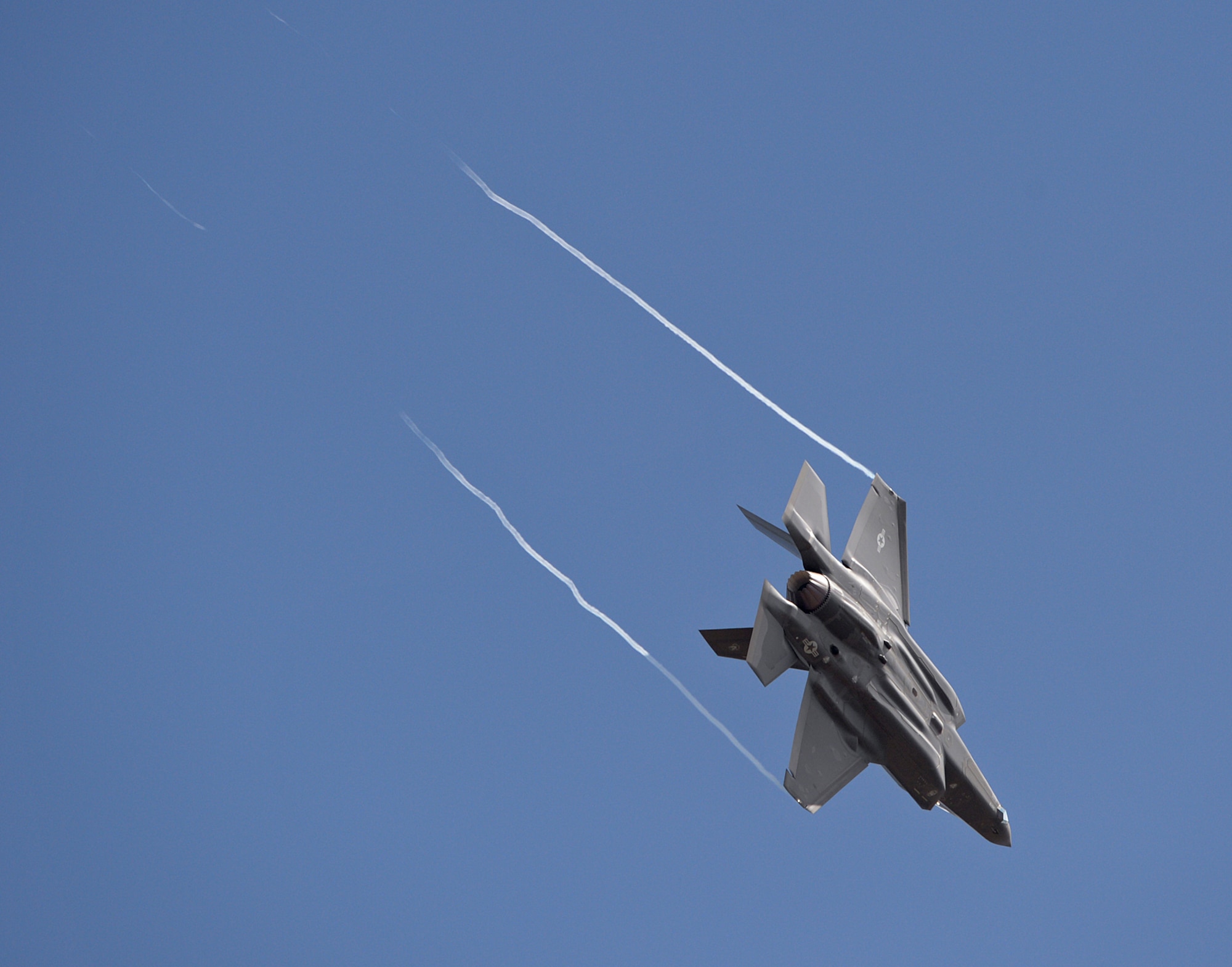 An F-35A Lightning II aircraft flies over Hill Air Force Base, Utah, Sept. 2, 2015. After landing, this aircraft and another became the first two operational F-35s to arrive at the base. The rest of the fleet of up to 72 F-35s will be coming in on a staggered basis, spread through 2019. There are several factors that make Hill ideally suited to receive the F-35 including access to the Utah Test and Training Range; Hill's robust base infrastructure; and its support team made up of dedicated Airmen from the active duty 388th Fighter Wing and Reserve 419th Fighter Wing. (U.S. Air Force photo by Alex R. Lloyd/Released)