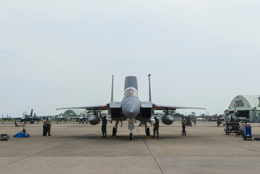 Members of the 44th Aircraft Maintenance Unit perform a final check before an F-15 Eagle takes off from Tsuiki Air Base, Japan, Sept. 2, 2015. The members deployed to Tsuiki, Japan, to participate in a two-week Aviation Training Relocation from Kadena Air Base, Japan, to help build interoperablitiy between the two forces. The U.S.-Japan security alliance has remained the cornerstone of peace and security in the Indo-Asia-Pacific region for 50 years. (U.S. Air Force photo by Senior Airman Stephen G. Eigel)