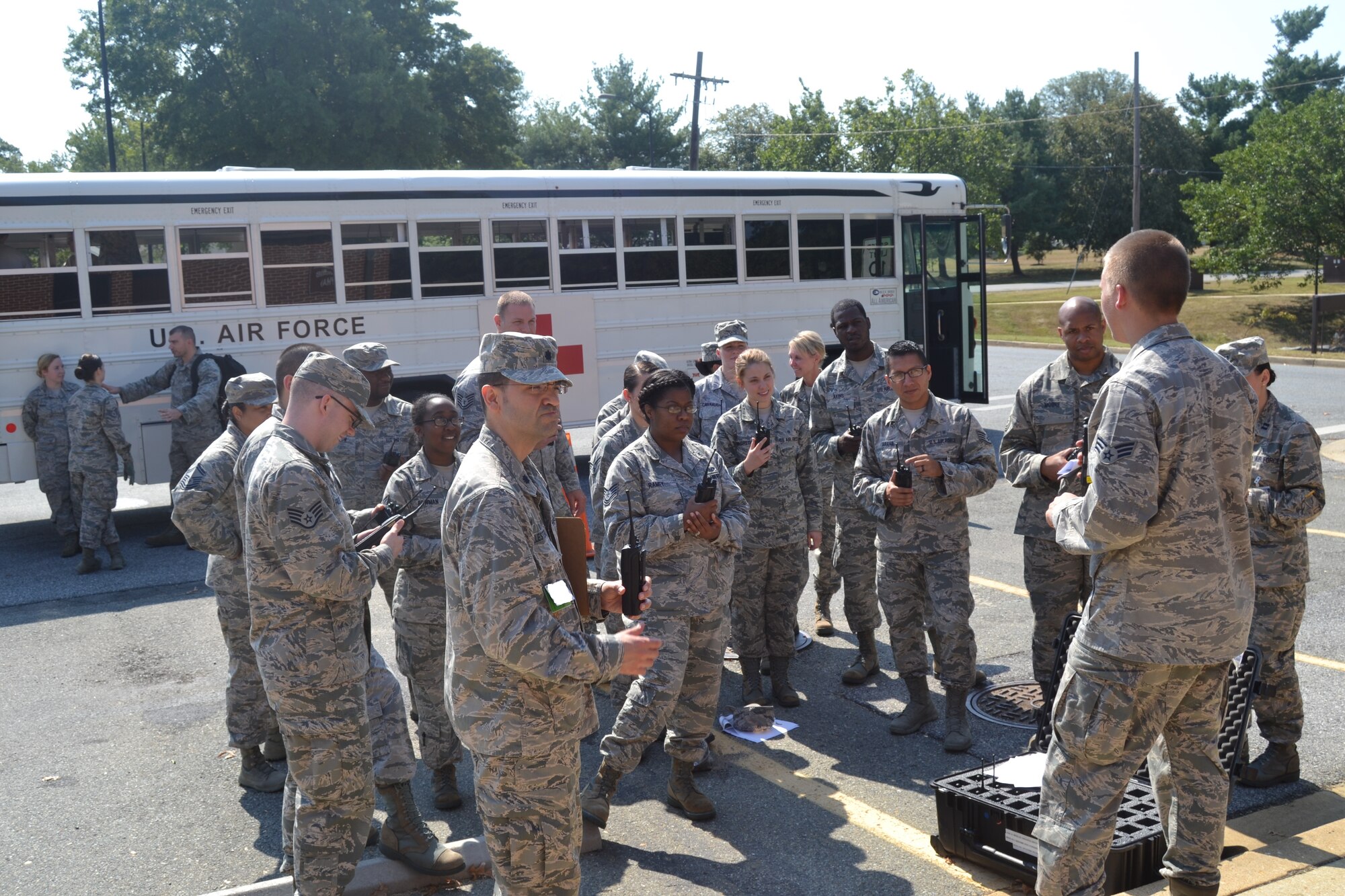 Emergency-readiness exercises are being held for first responders at the 79th Medical Wing on Joint Base Andrews in preparation for the upcoming air show on Sept. 19. Practicing for various emergency scenarios allows our first responders at the 79th Medical Wing and hospitals in the region the opportunity to train together for a myriad of contingencies. Radios were issued to medics and a class given before the exercise started. There is no expectation for an accident to occur during the 2015 Joint Base Andrews Air Show, but the exercise evaluated the response of base emergency personnel in the case of a mass casualty incident. (Photo by Major Derric Whiteside)