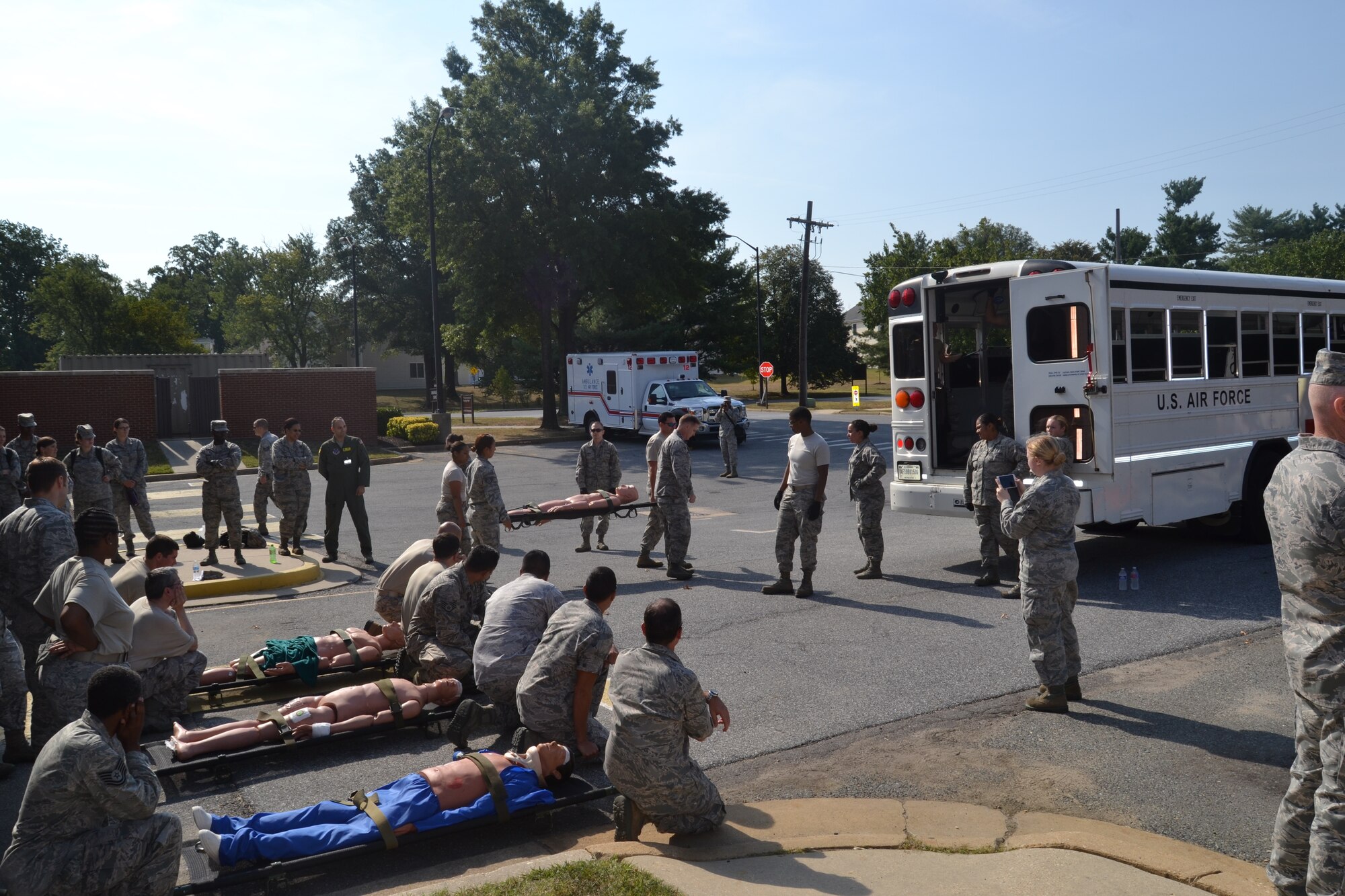 Emergency-readiness exercises are being held for first responders at the 79th Medical Wing on Joint Base Andrews in preparation for the upcoming air show on Sept. 19. Practicing for various emergency scenarios allows our first responders at the 79th Medical Wing and hospitals in the region the opportunity to train together for a myriad of contingencies. Medics are trained on how to handle moving liters to the AMBUS. There is no expectation for an accident to occur during the 2015 Joint Base Andrews Air Show, but the exercise evaluated the response of base emergency personnel in the case of a mass casualty incident. (Photo by Major Derric Whiteside)