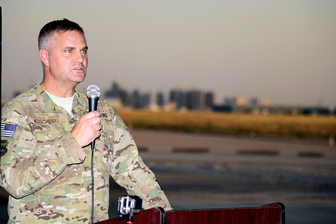U.S. Air Force Col. Michael Koscheski, 332nd Air Expeditionary Wing commander, speaks during the 1st Expeditionary Rescue Group activation and assumption of command ceremony at an undisclosed location in Southwest Asia, Sept. 1, 2015. Koscheski spoke of the importance of the activation of the rescue squadron and the aid it will provide the theater in Operation Inherent Resolve. (U.S. Air Force photo by Senior Airman Racheal E. Watson/Released)
