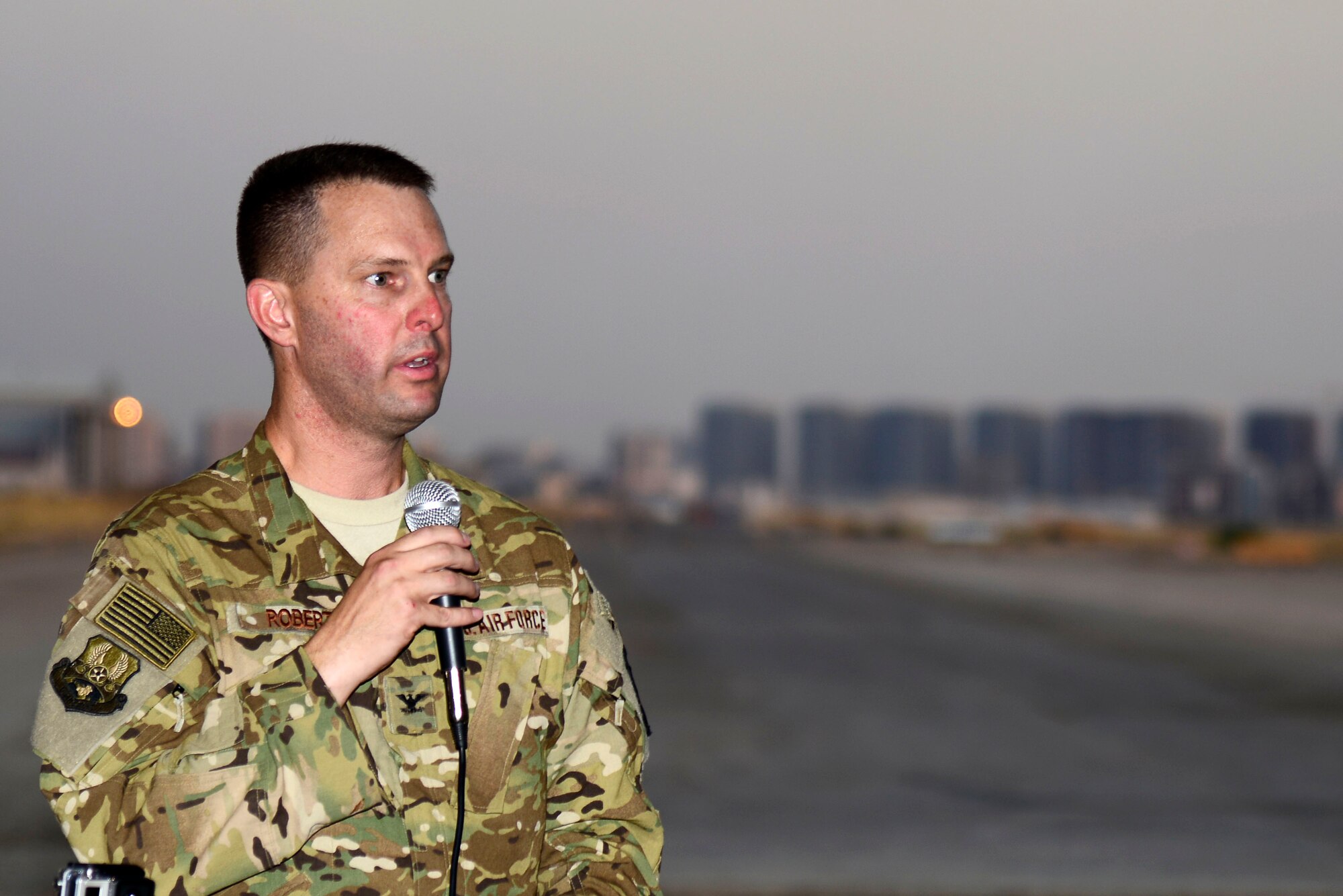 U.S. Air Force Col. Gregory Roberts, 1st Expeditionary Rescue Group commander, speaks during the 1st Expeditionary Rescue Group activation ceremony at an undisclosed location in Southwest Asia, Sept. 1, 2015. Roberts shared his command vision to support efforts to degrade and defeat the Islamic State and to move ahead based on lessons learned throughout history. (U.S. Air Force photo by Senior Airman Racheal E. Watson/Released)