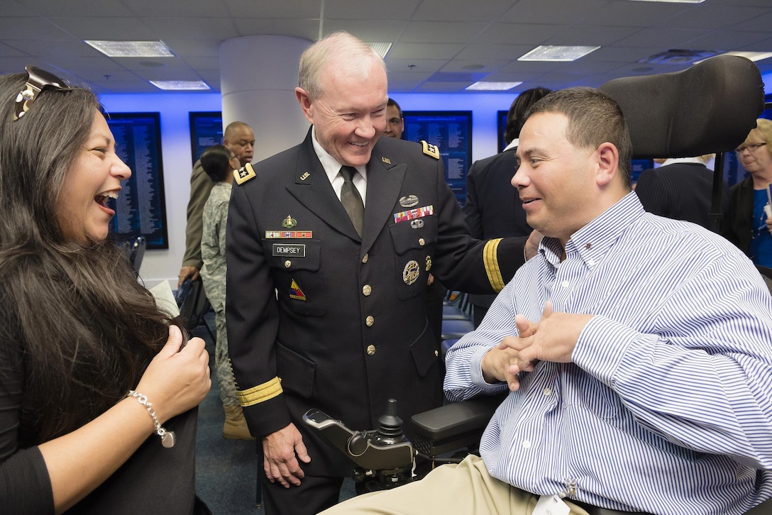Army Gen. Martin E. Dempsey, center, chairman of the Joint Chiefs of Staff, talks to a participant during the annual Newman's Own Awards in the Hall of Heroes at the Pentagon, Sept. 2, 2015. During the ceremony, six military nonprofit organizations received $200,000  for their innovative programs to improve military quality of life. Newman's Own, Fisher House Foundation and Military Times sponsored the awards. DoD photo by U.S. Army Staff Sgt. Sean K. Harp