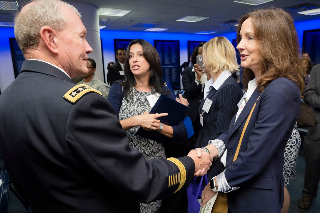 Army Gen. Martin E. Dempsey, center, chairman of the Joint Chiefs of Staff, talks to a participant during the annual Newman's Own Awards in the Hall of Heroes at the Pentagon, Sept. 2, 2015. During the ceremony, six military nonprofit organizations received $200,000 for their innovative programs to improve military quality of life. Newman's Own, Fisher House Foundation and Military Times sponsored the awards. DoD photo by U.S. Army Staff Sgt. Sean K. Harp