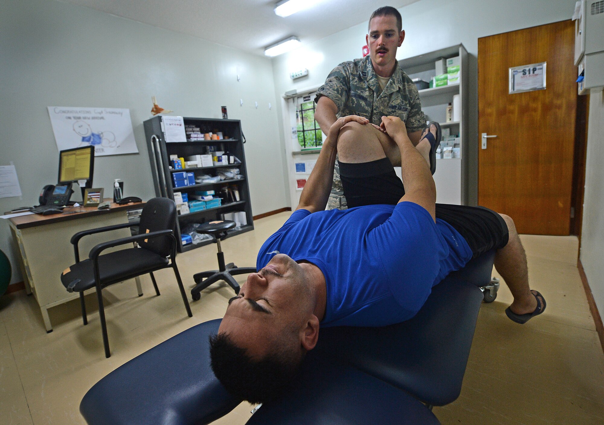 Capt. Joshua, 380th Expeditionary Medical Squadron physical therapist, performs a battery of tests on a patient to determine the extent of his injury at an undisclosed location in Southwest Asia Sept. 1, 2015. The physical therapy team is responsible for evaluating patients and utilizing different therapeutic procedures to help restore patient functions. (U.S. Air Force photo/Tech. Sgt. Jeff Andrejcik)  