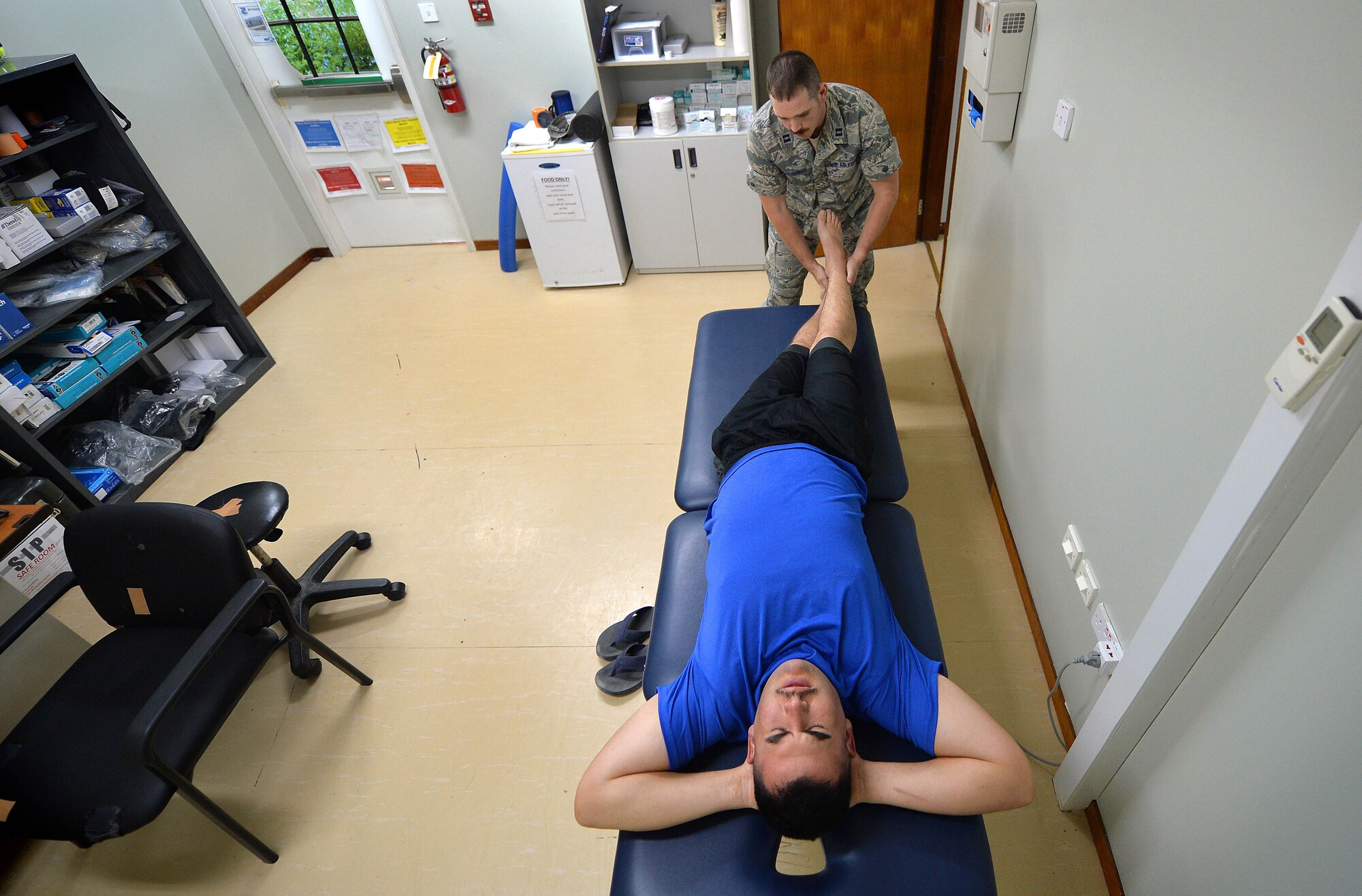 Capt. Joshua, 380th Expeditionary Medical Squadron physical therapist, performs a battery of tests on a patient to determine the extent of his injury at an undisclosed location in Southwest Asia Sept. 1, 2015. The physical therapy team is responsible for evaluating patients and utilizing different therapeutic procedures to help restore patient functions. (U.S. Air Force photo/Tech. Sgt. Jeff Andrejcik)  