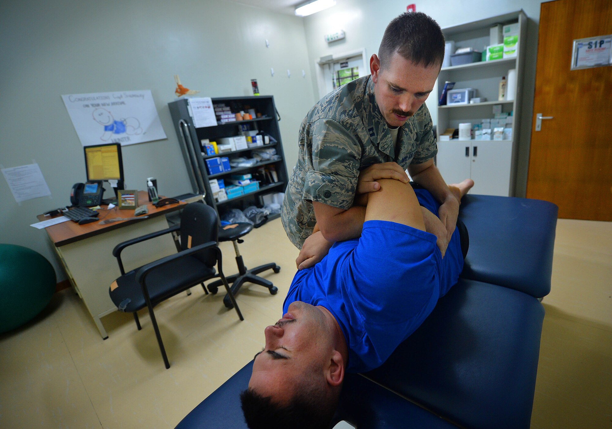 Capt. Joshua, 380th Expeditionary Medical Squadron physical therapist, performs a battery of tests on a patient to determine the extent of his injury at an undisclosed location in Southwest Asia Sept. 1, 2015. The physical therapy team is responsible for evaluating patients and utilizing different therapeutic procedures to help restore patient functions. (U.S. Air Force photo/Tech. Sgt. Jeff Andrejcik)  