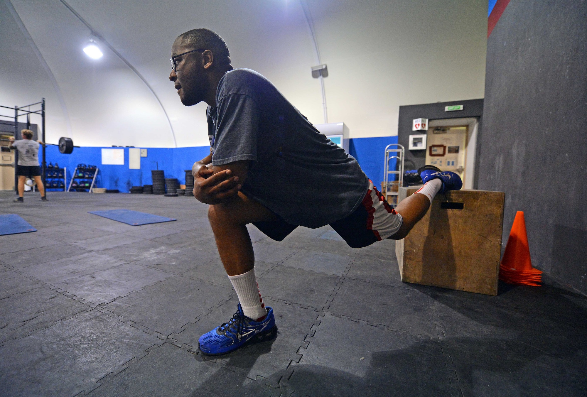 Staff Sgt. Jamey, 380th Expeditionary Security Forces Squadron member, stretches after completing strength and agility exercises at undisclosed location in Southwest Asia Sept. 3, 2015. Jamey is participating in the Physical Therapy Clinic’s strength and agility program to help rehabilitate his knees. (U.S. Air Force photo/Tech. Sgt. Jeff Andrejcik)     