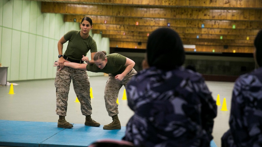 U.S. Marines with the Female Partner Force Engagement Team demonstrate Marine Corps Martial Arts Program during a subject matter expert exchange with the Qatari Internal Security Forces Female VIP Protection Unit in Qatar Aug. 18, 2015. The FPFET was comprised of U.S. Marines with the 15th Marine Expeditionary Unit as well as soldiers and sailors with Special Operations Command Central-Forward and Joint Special Operations Task Force-Arabian Peninsula. During the SMEE they covered medical care, marksmanship, and personal security detail strategies.