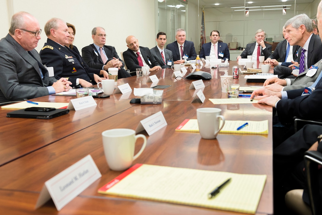 Army Gen. Martin E. Dempsey, second from left, chairman of the Joint Chiefs of Staff, listens to retired Air Force Gen. Norton A. Schwartz, right, while meeting with members of Business Executives for National Security in Washington, D.C., Sep. 2, 2015. DoD photo by U.S. Army Staff Sgt. Sean K. Harp