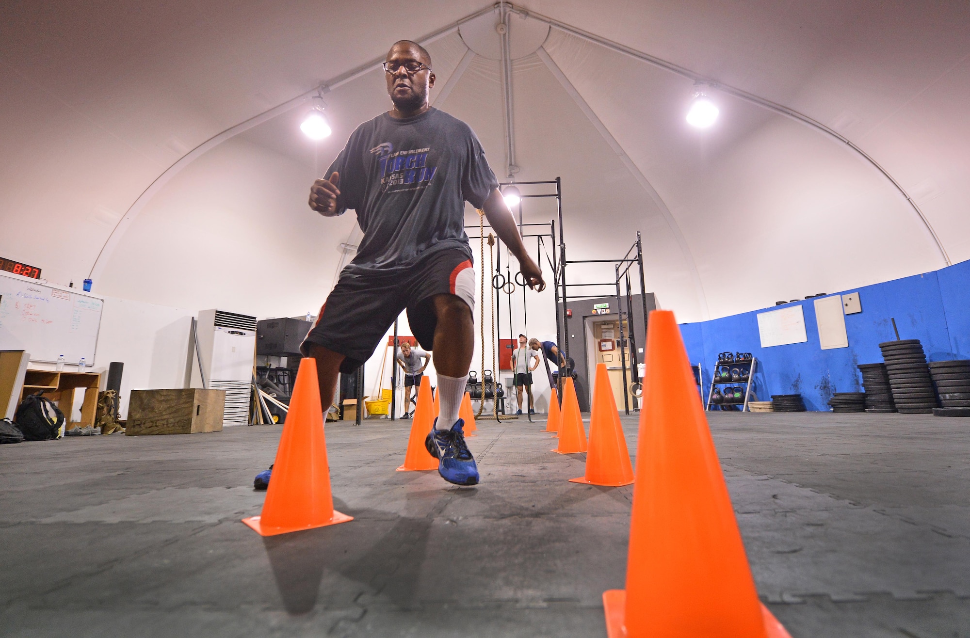 Staff Sgt. Jamey, 380th Expeditionary Security Forces Squadron member, runs through an agility exercise at undisclosed location in Southwest Asia Sept. 3, 2015. The agility drill is part of a physical therapy program Jamey is participating in to rehabilitate his knees. (U.S. Air Force photo/Tech. Sgt. Jeff Andrejcik)  