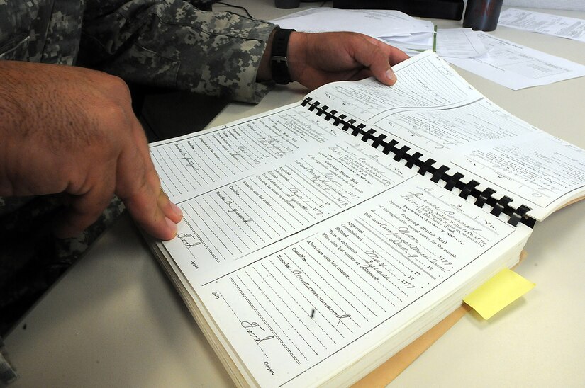 Staff Sgt. Joshua Conner reviews a copy of a company muster roll from his relative Lawrence Conner, who served with the 8th and 12th Virginia regiments during the Revolutionary War. The Conner family’s historical record book holds family documents that date back to the beginnings of America. Among a collection of family military service in the book, J. Conner shares the story of his relative 1st. Lt. Garlin Murl Conner, World War II veteran, who is reportedly the second most decorated soldier from World War II. (U.S. Army photo by Spc. David Lietz/Released)