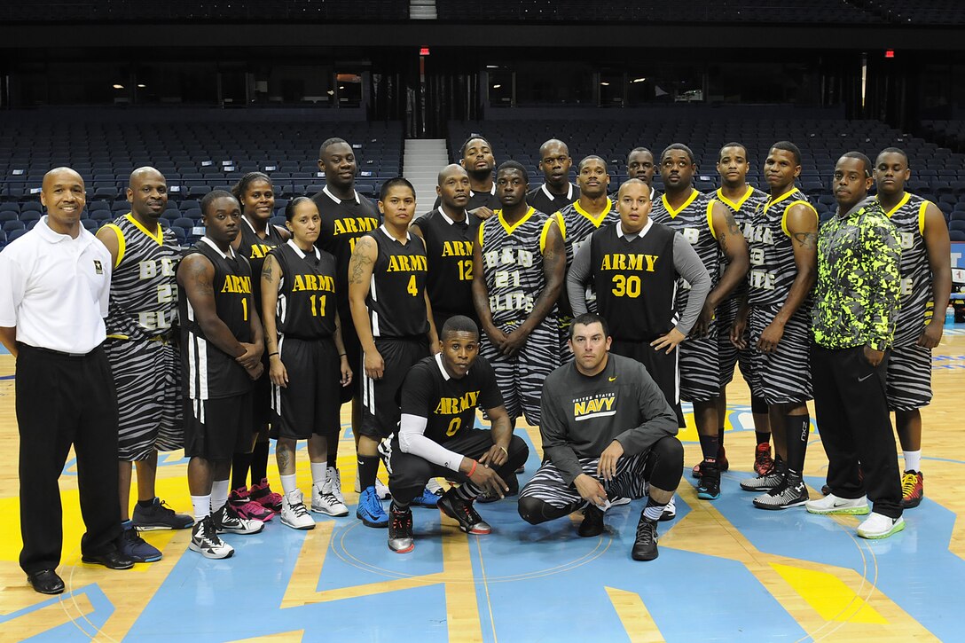 Sailors and Army Reserve soldiers pause for a photo on the court following an ‘Army vs. Navy’ exhibition game at Allstate Arena in Rosemont, Ill., Aug. 30. The event, hosted by Support All Veterans Equally Foundation and the WNBA’s Chicago Sky basketball team, was part of a pre-game event leading up to the Sky’s game that evening against the Connecticut Sun.
(U.S. Army photo by Spc. David Lietz/Released)