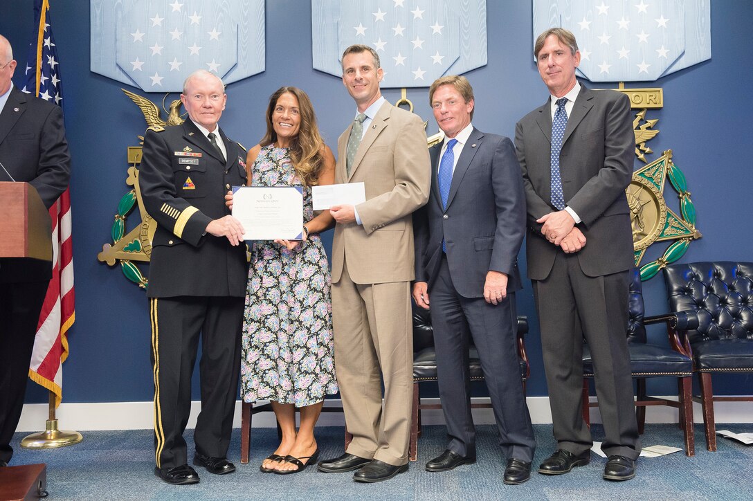 Army Gen. Martin E. Dempsey, chairman of the Joint Chiefs of Staff, poses with participants during the annual Newman's Own Awards ceremony in the Hall of Heroes at the Pentagon, Sept. 2, 2015. DoD photo by U.S. Army Staff Sgt. Sean K. Harp