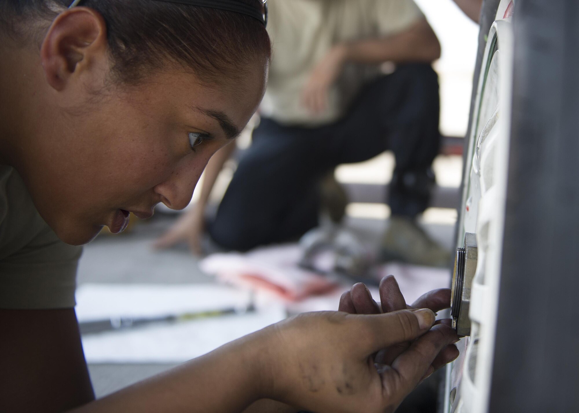 Staff Sgt. Ashley Grugin, a 77th Aircraft Maintenance Squadron maintainer out of Shaw Air Force Base, S.C., woks on a F-16 tire during a Red Flag exercise Thursday, Aug. 20, 2015 at Nellis Air Force Base, Nev. NASIC provides real-time documentation to help train both U.S. and allied nations’combat air forces. The exercise gives pilots the experience of multiple, intensive air combat sorties in the safety of a training environment. (U.S. Air Force photo by Senior Airman Justyn Freeman)