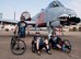 Jarrod Smith, (left), Clay Jacobs, (middle), and Christopher Freeman, (right), take a break at a rest stop at Sheppard Air Force Base, Texas, during the Hotter'N Hell 100 bike race Aug. 29, 2015. Freeman is a veteran who was paralyzed from the waist down after a car accident in 2010. He has participated in three Hotter'N Hell rides since the accident to share his story of resiliency with other riders, and observers along the route. (U.S. Air Force photo by Danny Webb)
