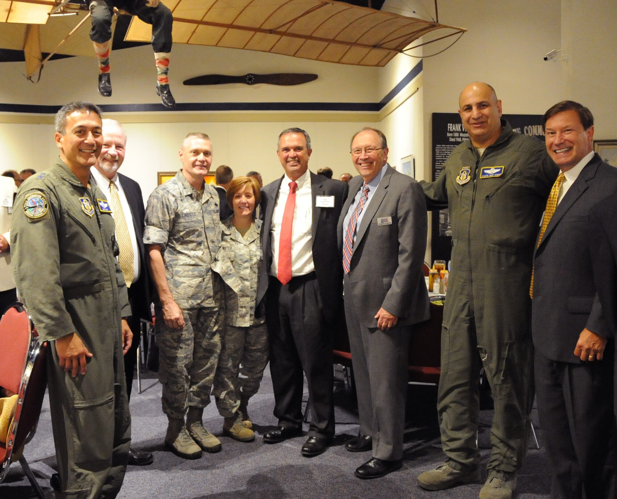 Maj. Gen. Richard S. Haddad, Air Force Reserve Command vice commander, and Maj. Gen. Michael D. Kim, Mobilization Assistant to the Commander Air Force Reserve Command, greet attendees at the 21st Century Partnership Congressional luncheon Sept. 3, 2015 at the Museum of Aviation. (U.S. Air Force photo/Tech. Sgt. Mercedes Crossland)