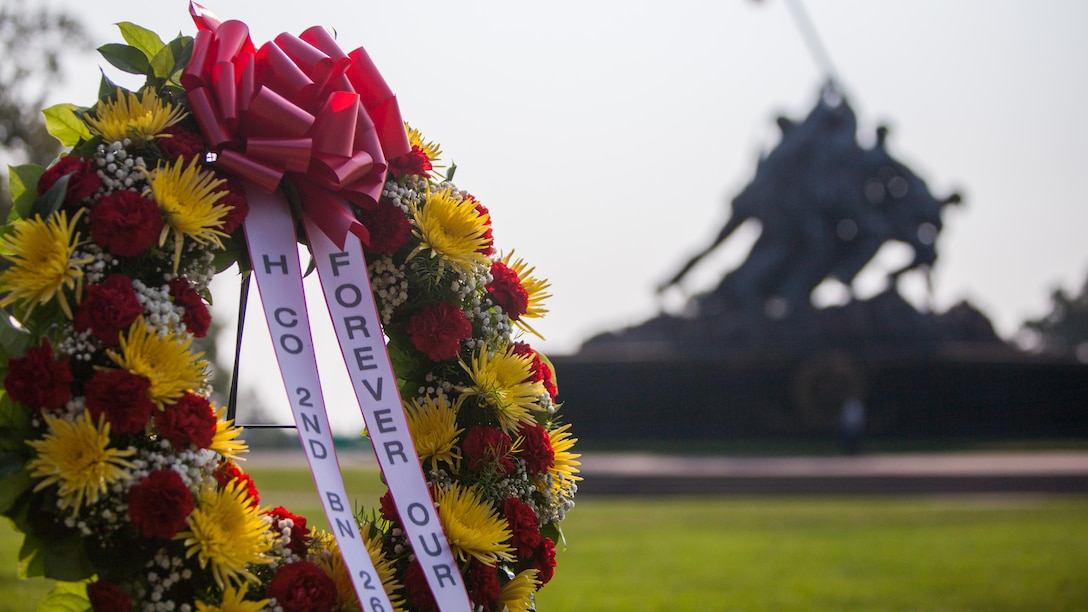 Members of Company “H”, 2nd Battalion, 26th Marines gather for a ceremony held at the Marine Corps War Memorial at Arlington, Va., Sept. 3. The wreath was laid in honor of the 74 Marines and sailors who did not come home.