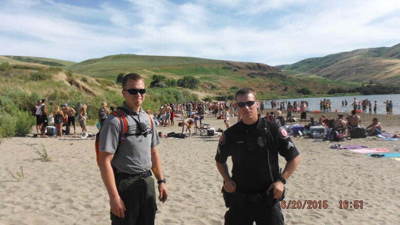 U.S. Army Corps of Engineers Park Ranger Chris Lorz (left) and Washington State University Police Officer Matthew Kuhrt patrol Illia Dunes June 20. The Corps, WSU and the Garfield County Sheriff’s Office conduct patrols of popular party spots on the Snake River to help keep conditions safe for all visitors to enjoy.