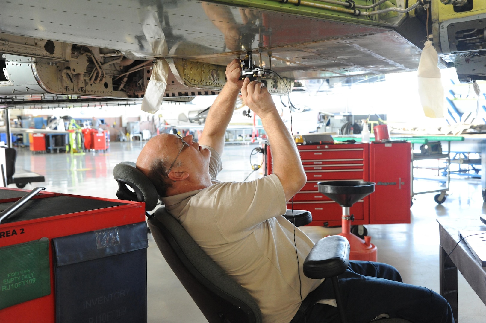 Guy Edwards, 12th Flying Training Wing maintenance technician, performs bolt tail maintenance on a T-38 Talon during the aircraft's phase maintenance inspection Aug. 17, 2015 at Joint Base San Antonio-Randolph.   To ensure aircraft remain operational 12th FTW maintenance personnel conduct phase maintenance to make sure the aircraft is in working order.  
