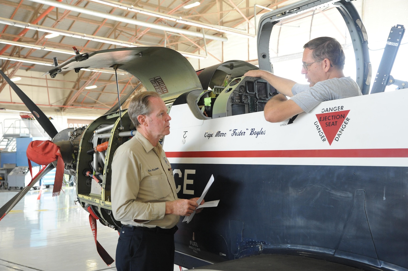 Ken Blackman (left), 12th Flying Training Wing maintenance work leader and Richard Peterson, maintenance technician, inspect a T-6 Texan during the aircraft's phase maintenance inspection Aug. 17, 2015 at Joint Base San Antonio-Randolph.   To ensure aircraft remain operational, 12th FTW maintenance personnel conduct phase maintenance to make sure the aircraft is in working order. 