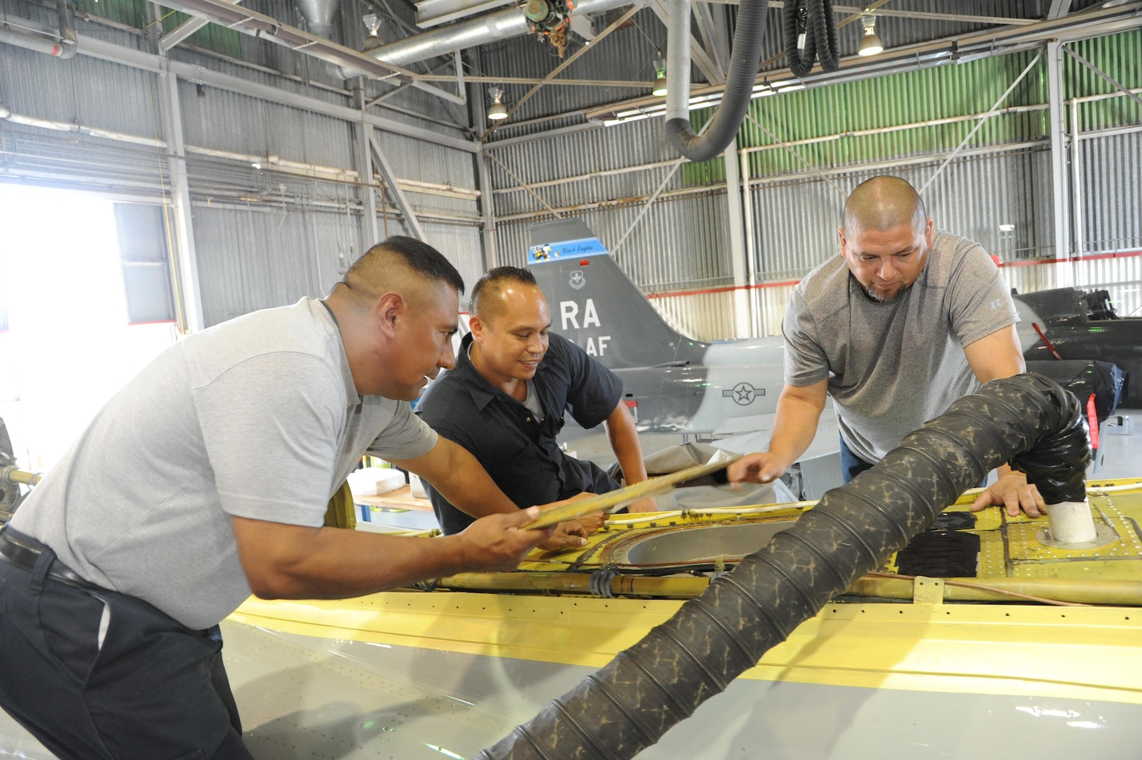 Roy Lowe, 502nd Civil Engineer Squadron, Joint Base San Antonio-Fort Sam Houston, cuts bricks to the precise size to place on Washington Circle star Aug. 20, 2015 at JBSA-Randolph. The star on the traffic island in Washington Circle, one of the earliest features of the Army Air Corps’ Randolph Field more than eight decades ago, will soon become a distinctive hardscape filled with terracotta paver bricks and bordered by multi-colored river stones and decomposed granite while retaining its five-pointed appearance. 