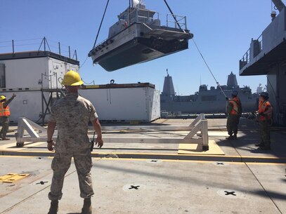 Marines with Combat Logistics Regiment 1, Combat Logistics Regiment 15 and Sailors of Navy Cargo Hauling Battalion 1 prepare the TAVB Curtis for departure during Exercise Dawn Blitz 15, a multinational, scenario-driven amphibious training exercise. 

