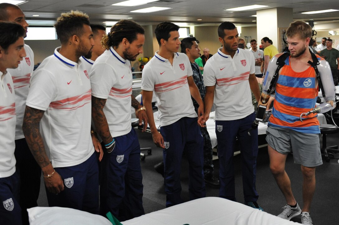 Members of the U.S. men's national soccer team visit with Cody Iorns, a wounded warrior, at Walter Reed National Medical Center in Bethesda, Md., Sept. 3, 2015. DoD photo by Marvin Lynchard