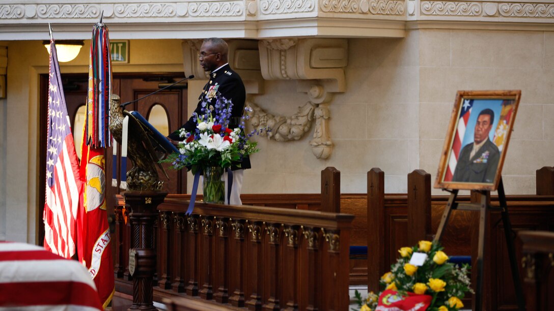 Lt. Gen. Ronald L. Bailey, Deputy Commandant Plans, Polices, and Operations, speaks about Lt. Gen. Frank E. Petersen, Jr. (ret.) during a memorial service at the U.S. Naval Academy in Annapolis, Md., Sept. 3, 2015. Petersen died Aug. 25, 2015, after succumbing to lung cancer. During his career, Petersen flew more than 350 combat missions and more than 4,000 hours in various military aircraft. 