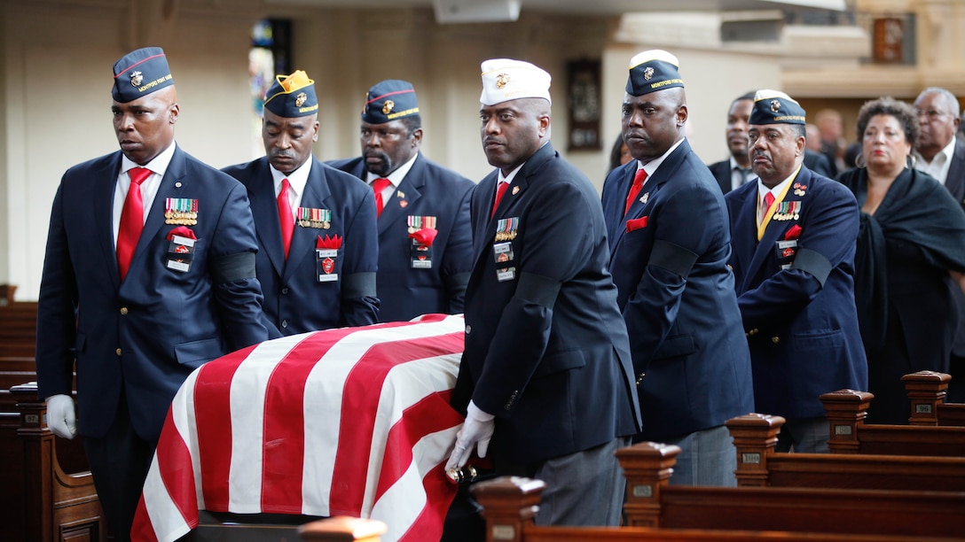 Members of the Montford Point Marine Association carry the casket of Lt. Gen. Frank E. Petersen, Jr. (ret.) during his memorial service at the U.S. Naval Academy in Annapolis, Md., Sept. 3, 2015. Petersen died Aug. 25, 2015, after succumbing to lung cancer. Petersen was the first African-American Marine Corps aviator and general officer. 