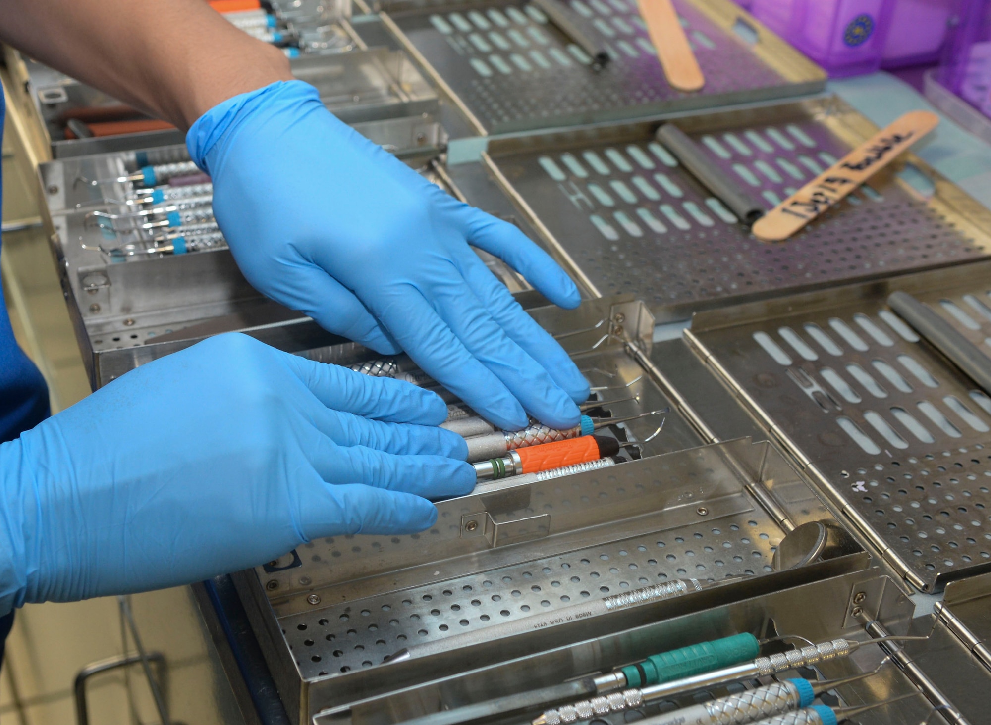 Staff Sgt. Christian Gallevo, 2nd Dental Squadron dental technician, inspects medical instruments after the tools went through a cleaning process at Barksdale Air Force Base, La., Sept. 1, 2015. The integrity of the instruments are inspected to make sure they work correctly and are not chipped or rusted. (U.S. Air Force photo/Senior Airman Amanda Morris)