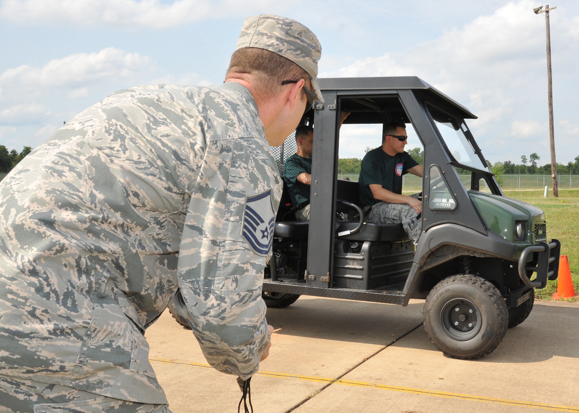 Master Sgt. Darren Walls, 2015 Global Strike Challenge evaluator, starts a stopwatch to time the 2nd Munitions Squadron nuclear maintenance team during the weapons transport competition at Barksdale Air Force Base, La., Aug. 31. The nuclear maintenance team traveled 100 yards from the start line to reposition a Material Handling Unit-196. (U.S. Air Force photo/Senior Airman Joseph Raatz)