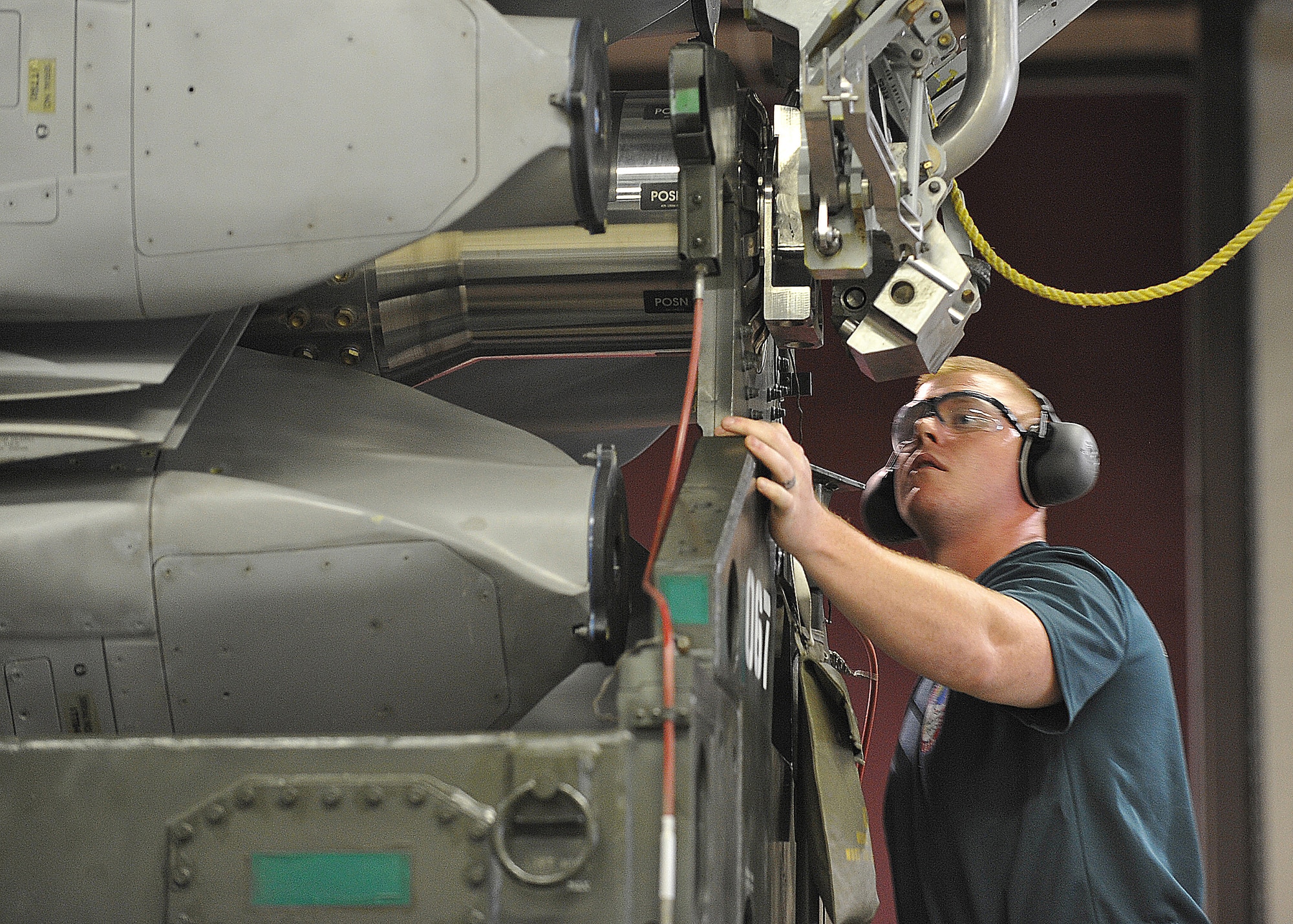 Senior Airman Joe Travers, 2nd Munitions Squadron nuclear maintenance team member, checks the alignment of a common strategic rotary launcher during the nuclear maintenance portion of the 2015 Global Strike Challenge at Barksdale Air Force Base, La., Sept. 1. The CSRL can house up to eight AGM-86 air-launched cruise missiles. (U.S. Air Force photo/Senior Airman Joseph Raatz)