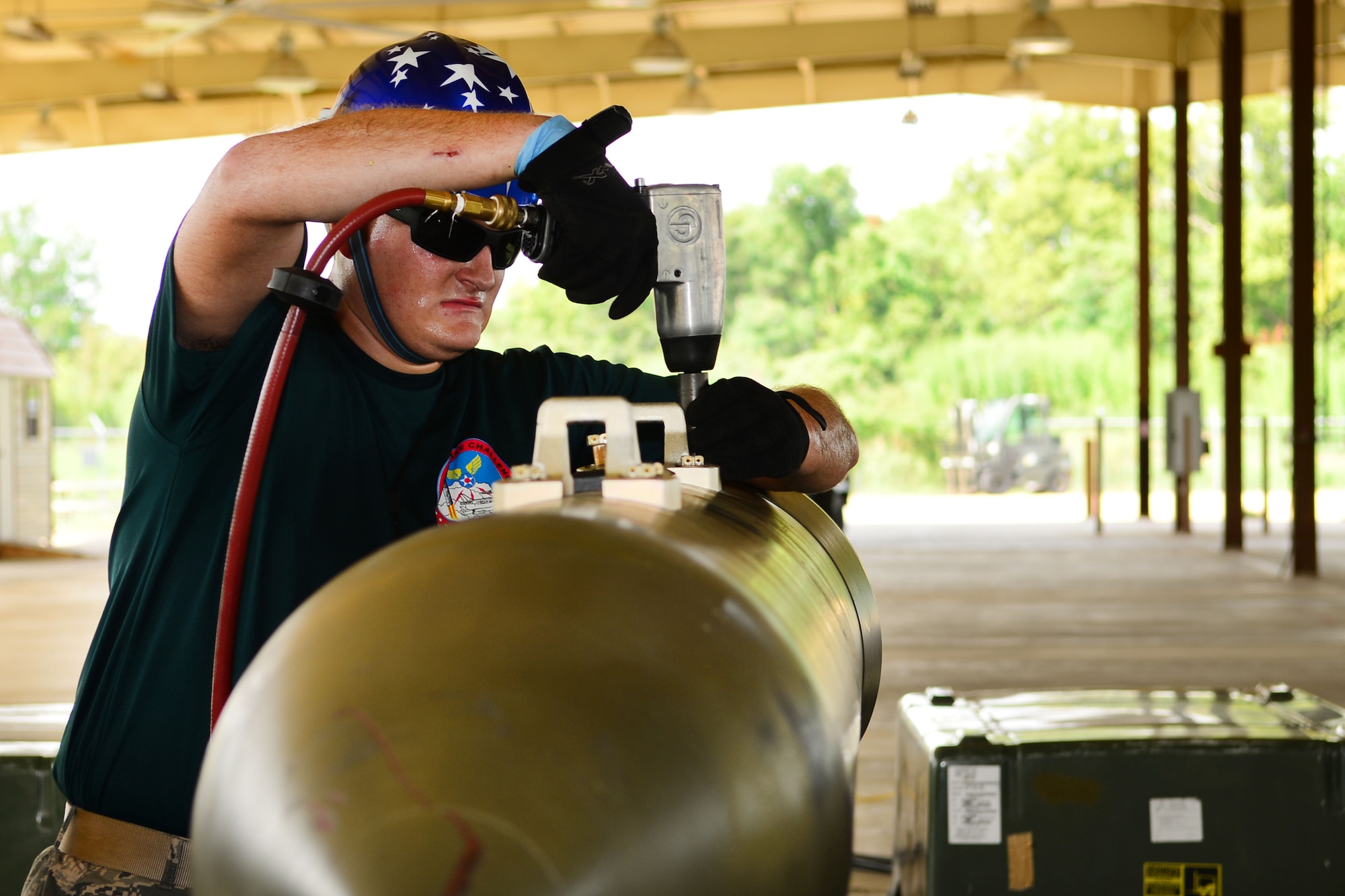 Senior Airman Christopher Young, 2nd Munitions Squadron Conventional Bomb Build Team member, assembles parts to an inert munition at Barksdale Air Force Base, Aug. 31, 2015. The Global Strike Challenge is the world's premier bomber, Intercontinental Ballistic Missile and security forces competition with units from Air Force Global Strike Command, Air Combat Command, Air Force Materiel Command, Air Force Reserve Command and Air National Guard. (U.S. Air Force photo by Senior Airman Benjamin Raughton)