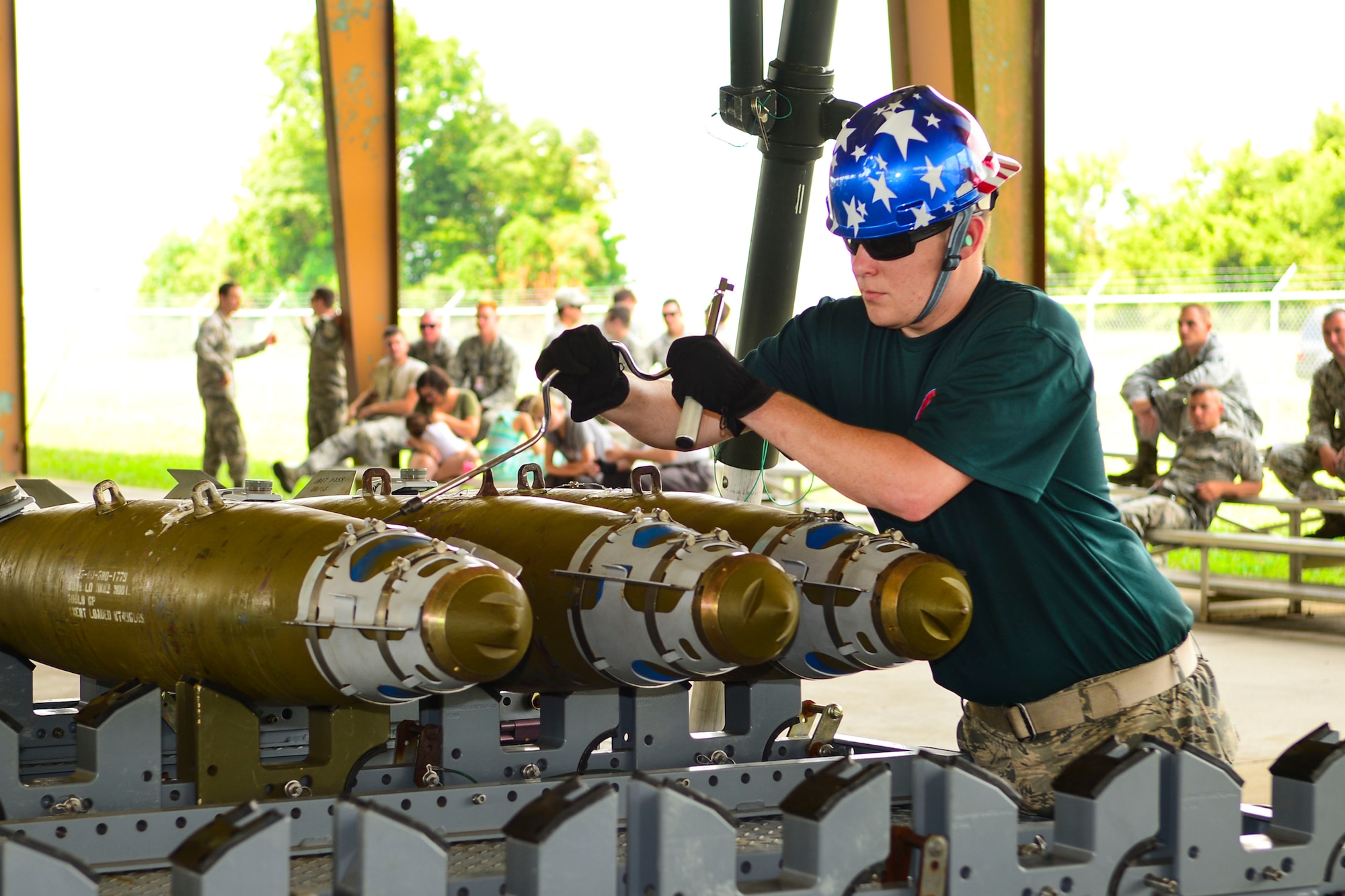 A 2nd Munitions Squadron Conventional Bomb Build team member assembles parts to an inert munition at Barksdale Air Force Base, La., Aug. 31, 2015. The 2nd MUNS Airmen represented the 2nd Bomb Wing during the conventional ammo competition. (U.S. Air Force photo by Senior Airman Benjamin Raughton)