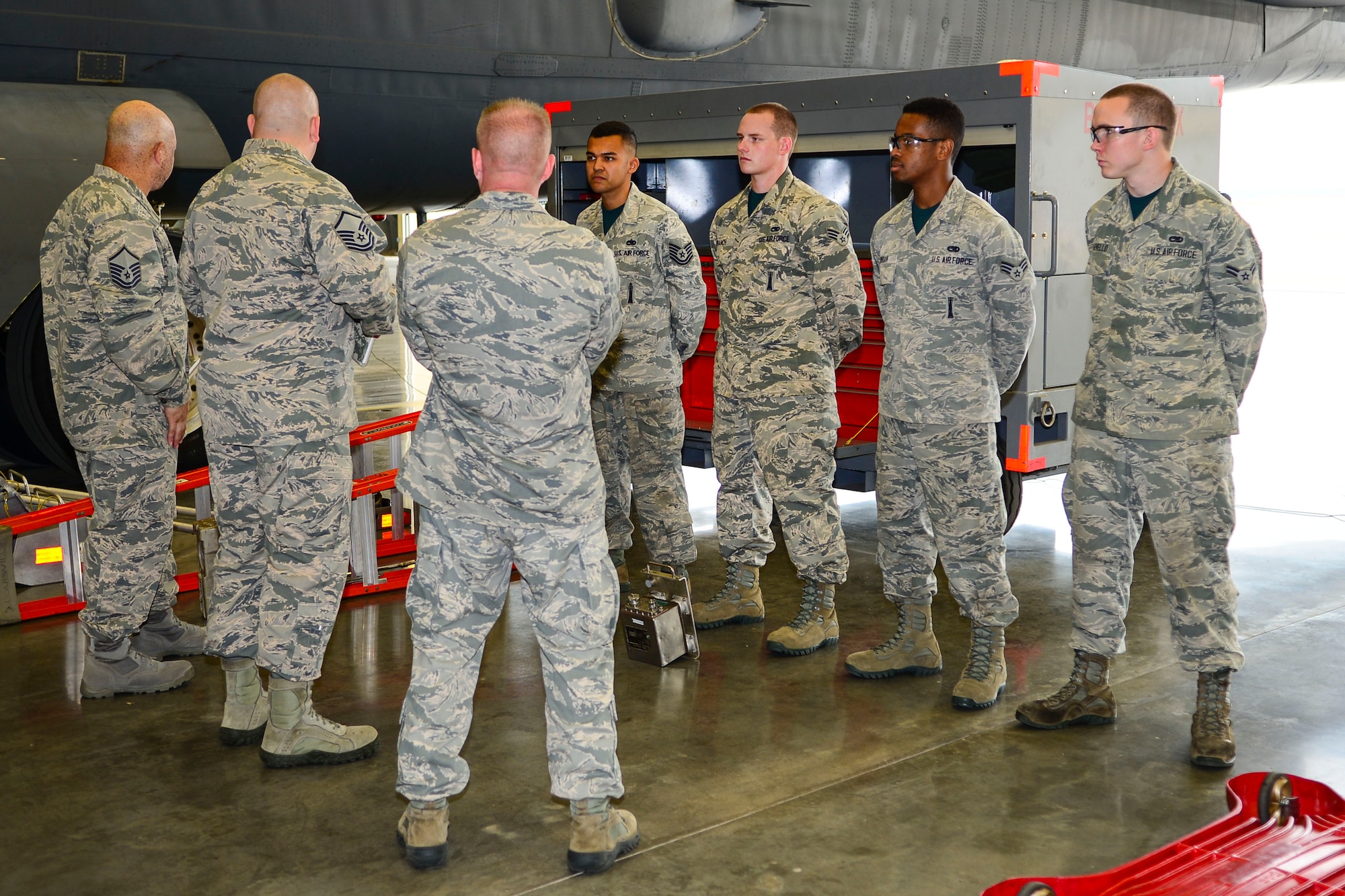 Airmen from the 2nd Aircraft Maintenance Squadron Conventional Load Team receive a briefing from inspectors before the weapons load during the 2015 Global Strike Challenge at Barksdale Air Force Base, La., Sept. 1, 2015. Through competition and teamwork, the event fosters esprit de corps, recognize outstanding Air Force Global Strike Command personnel and teams and improve combat capabilities. (U.S. Air Force photo by Senior Airman Benjamin Raughton)