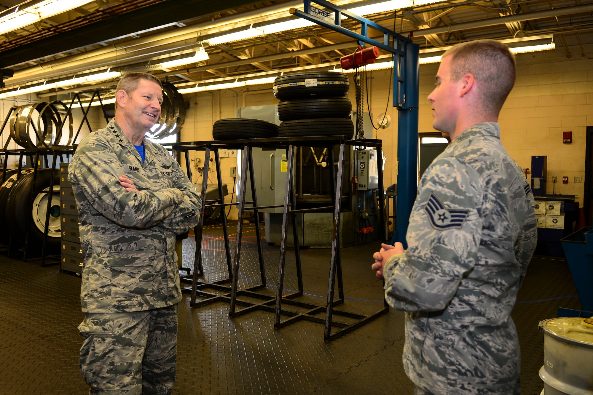 Gen. Robin Rand, commander of Air Force Global Strike Command, speaks to Staff Sgt. Austin Groupp, 2nd Maintenance Squadron wheel and tire repair and reclamation, at Barksdale Air Force Base, La., Aug.28, 2015. During his immersion tour, Rand visited the Airmen who keep the B-52 Stratofortress flying daily and listened to how they impact the mission. (U.S. Air Force photo/Senior Airman Benjamin Raughton)
