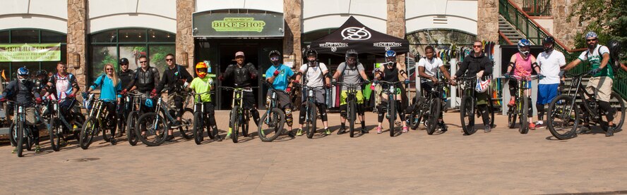 Participants of an F.E. Warren Air Force Base Outdoor Recreation trip pose for a group photo at a bike park in Steamboat Springs, Colo., Aug. 29, 2015. The trip consisted of a day of riding the downhill mountain biking trails carved into Mount Werner in Routt National Forest and soaking at a local hot spring afterwards.  (U.S. Air Force photo by Lan Kim)