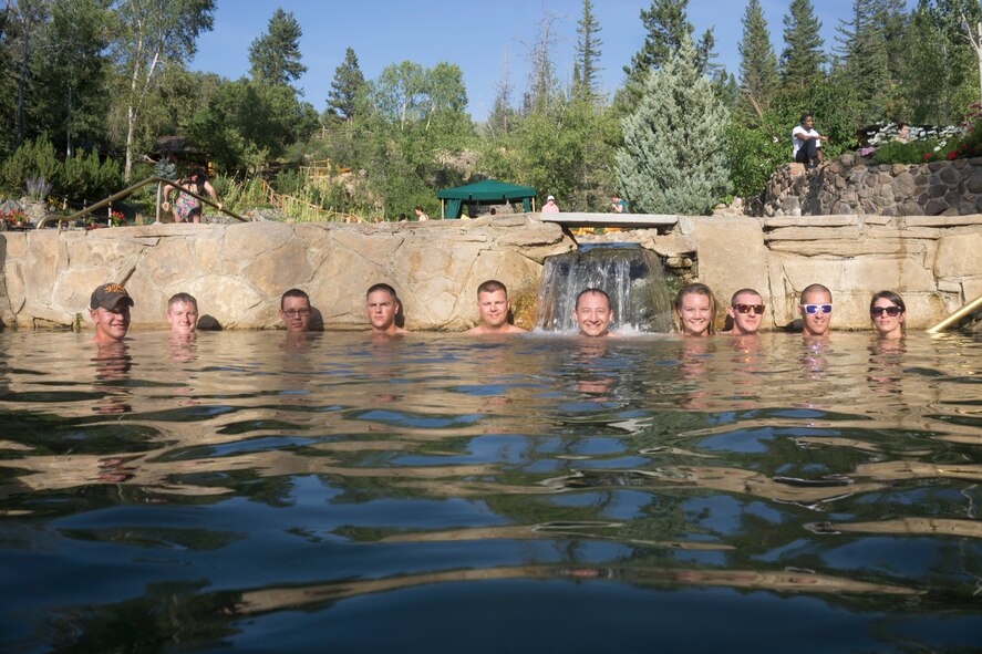 Participants of an F.E. Warren Air Force Base Outdoor Recreation trip relax in a local hot spring in Steamboat Springs, Colo., Aug. 29, 2015. The trip consisted of a day of riding the downhill mountain biking trails carved into Mount Werner in Routt National Forest and soaking at a local hot spring afterwards.  (U.S. Air Force photo by Lan Kim)
