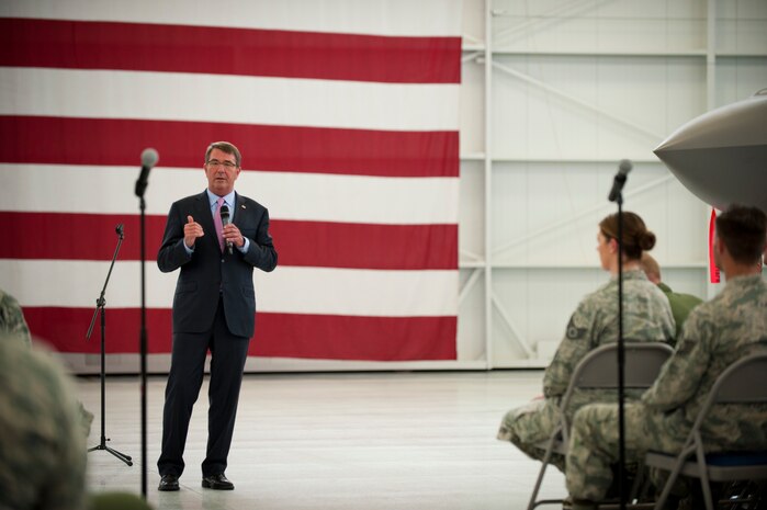 Defense Secretary (Dr.) Ash Carter addresses Nellis Airmen and Coalition partners during an all call inside the Lightning Aircraft Maintenance Unit hangar at Nellis Air Force Base, Nev., Aug. 26, 2015. During the Secretary’s visit to Nellis he observed Red Flag 15-4 and spoke to Airmen and Coalition partners. During the all call, Carter took questions from service members and addressed issues relating to budgets, force retention, morale, and operational priorities. Carter, the nation’s 25th Defense Secretary, was sworn into the position earlier this year on February 17. (U.S. Air Force photo by Senior Airman Joshua Kleinholz)