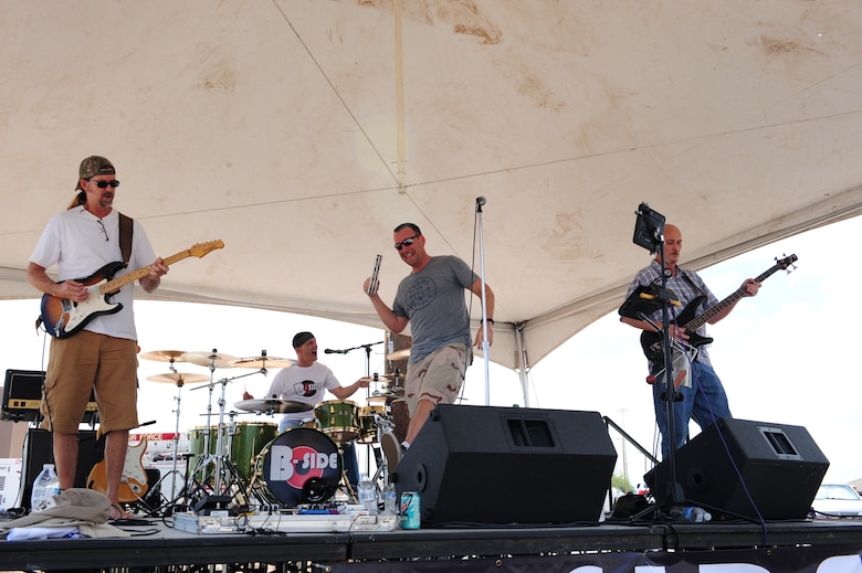 The B-Side band performs during a “Welcome Home” barbecue at Davis-Monthan Air Force Base Ariz., Sept. 3, 2015. The Tucson community members hosted the barbecue for all Desert Lightning Team Airmen to have fun and enjoy time with their friends and families after completing the largest deployment cycle in D-M history. (U.S. Air Force photo by Airmen 1st Class Cheyenne A. Powers/Released)