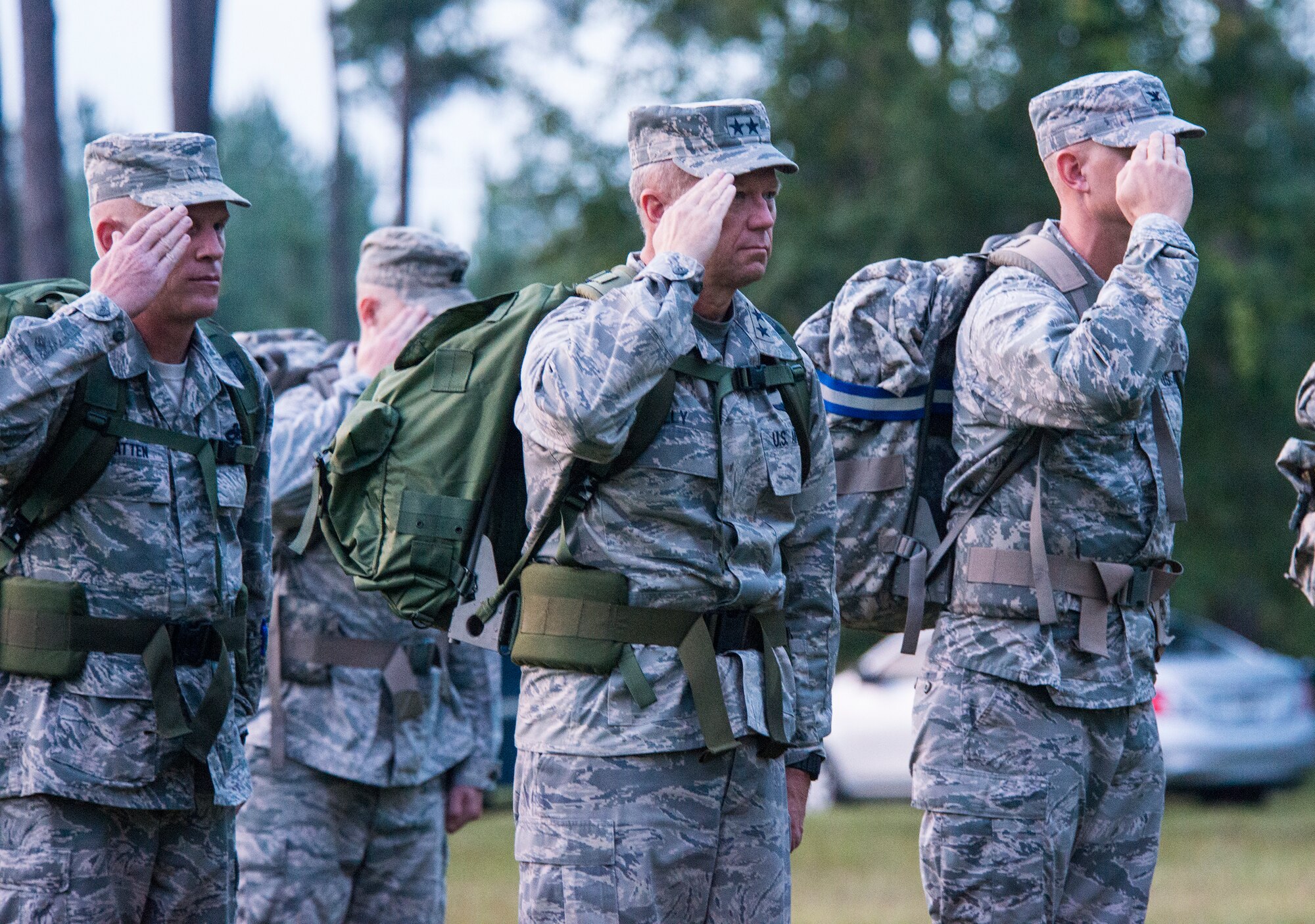 U.S. Air Force Maj. Gen. Mark Kelly, Ninth Air Force commander, and 93rd Air Ground Operations Wing leadership render a salute before a four-mile ruck march Sept. 1, 2015, at Moody Air Force Base, Ga. Kelly selected Moody for his first official visit because of its diverse mission and the unique capabilities of the Airmen stationed there. (U.S. Air Force photo by Airman 1st Class Ceaira Tinsley/Released)